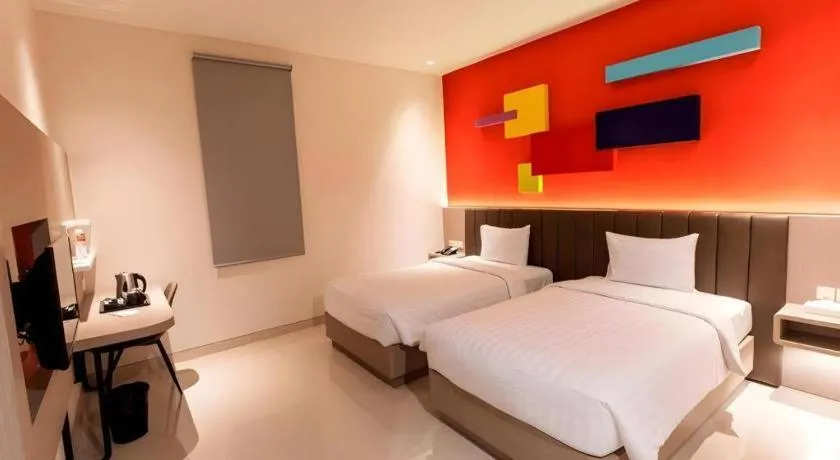 Bed in Zoom Dharmahusada Hotel