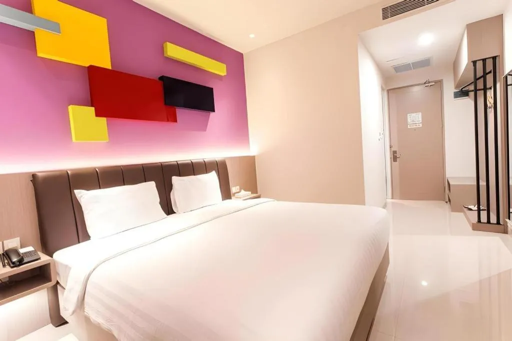 Bed in Zoom Dharmahusada Hotel