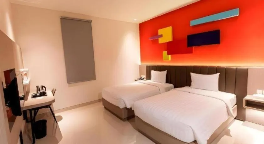 Bed in Zoom Dharmahusada Hotel