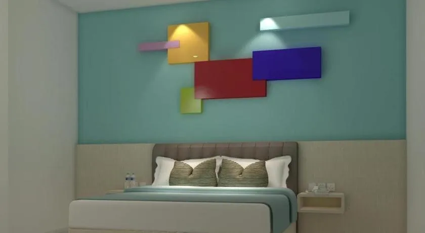 Bed in Zoom Dharmahusada Hotel