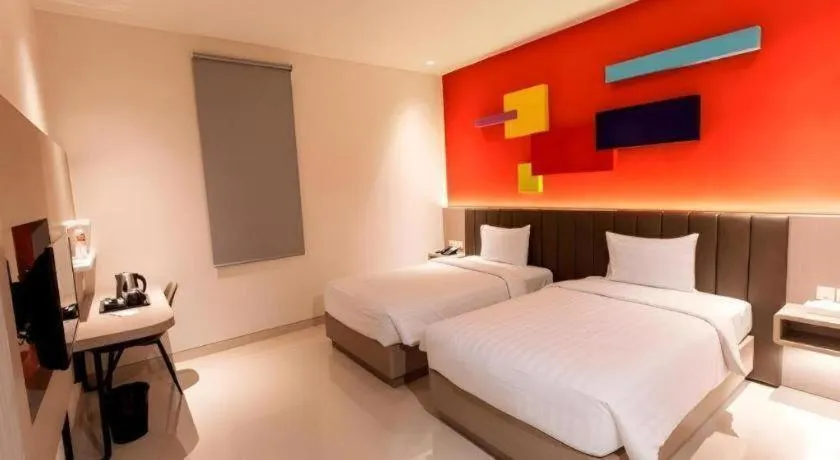 Bed in Zoom Dharmahusada Hotel