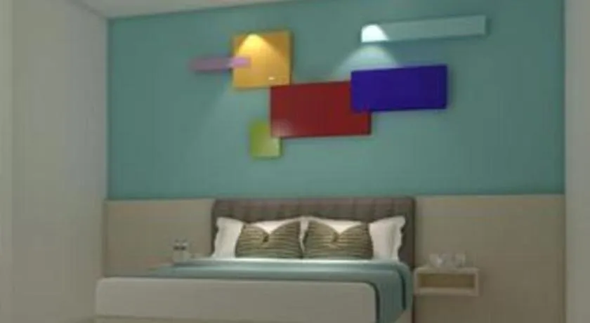 Bed in Zoom Dharmahusada Hotel