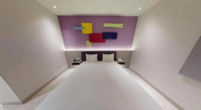 Bed in Zoom Dharmahusada Hotel