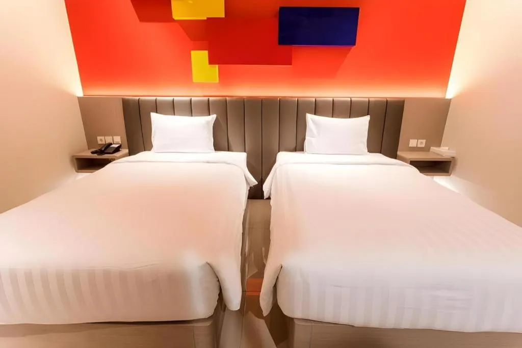 Bed in Zoom Dharmahusada Hotel