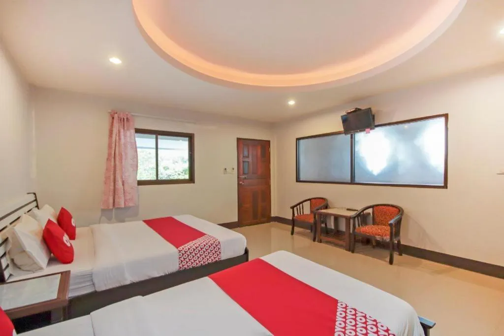 Bed in OYO 75310 Canalis Resort