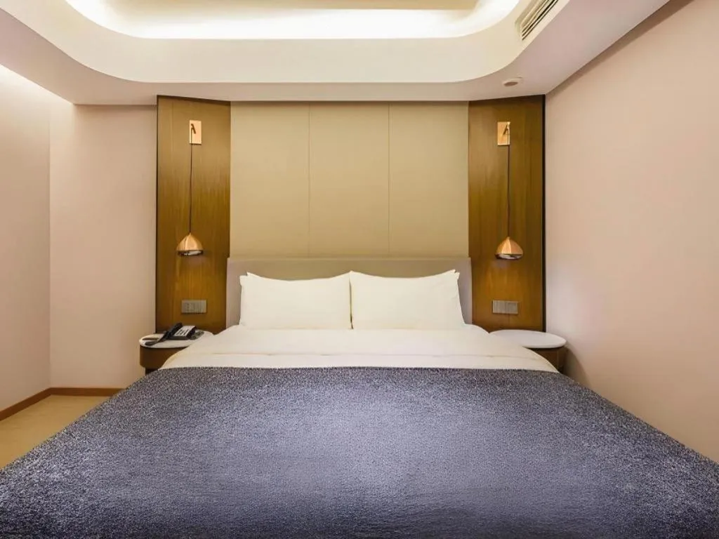 Bed in Yitel Collection Beijing Capital Airport New International Exhibition