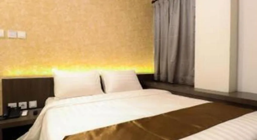 Bed in NIVIA HOTEL