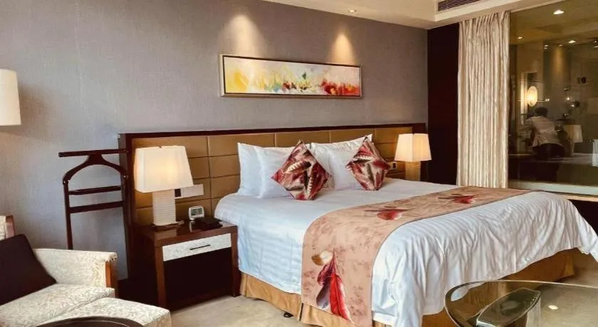 Bed in New Century Grand Hotel Lishui Huaqiao