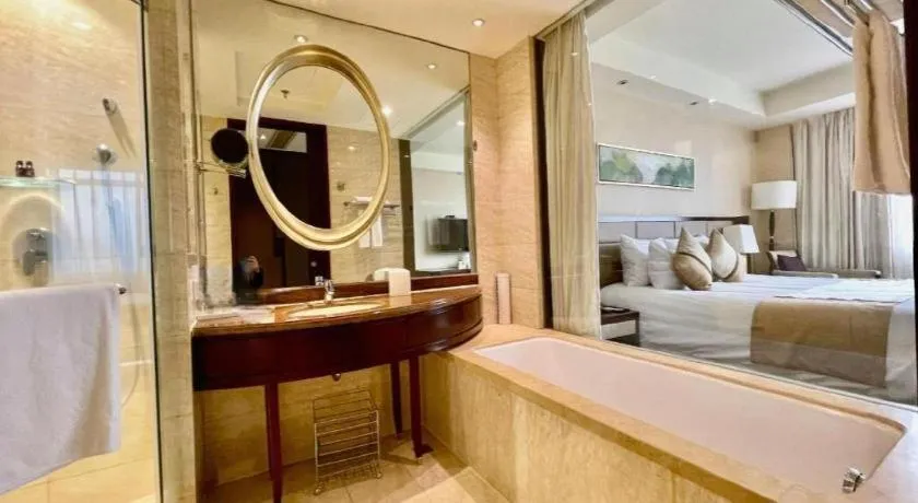 Bed in New Century Grand Hotel Lishui Huaqiao