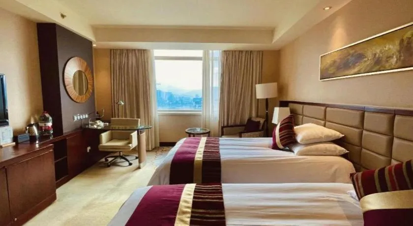 Bed in New Century Grand Hotel Lishui Huaqiao