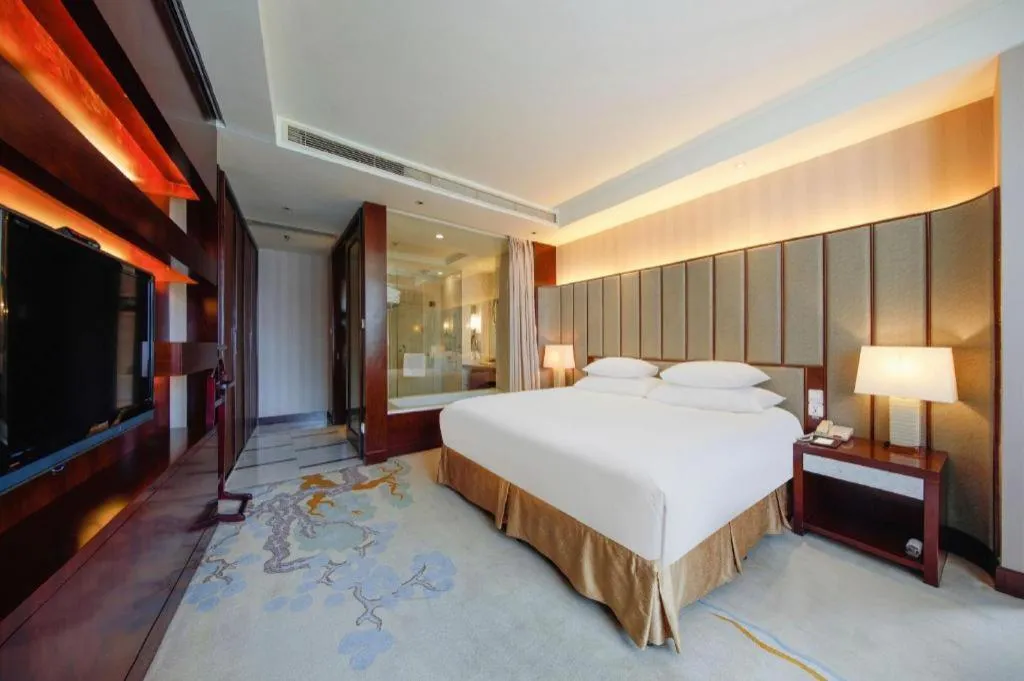Bed in New Century Grand Hotel Lishui Huaqiao