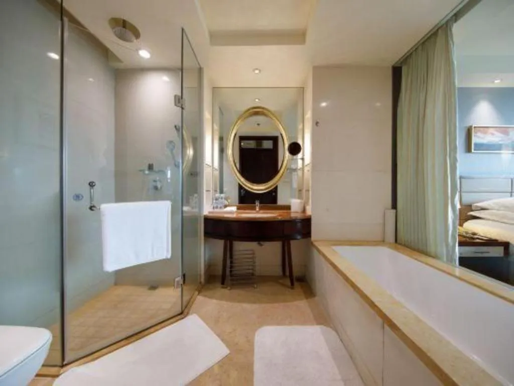 Bed in New Century Grand Hotel Lishui Huaqiao