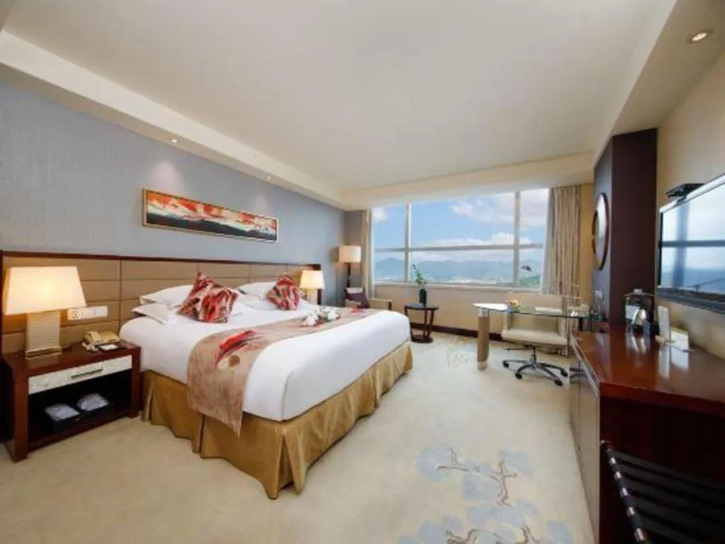 Bed in New Century Grand Hotel Lishui Huaqiao