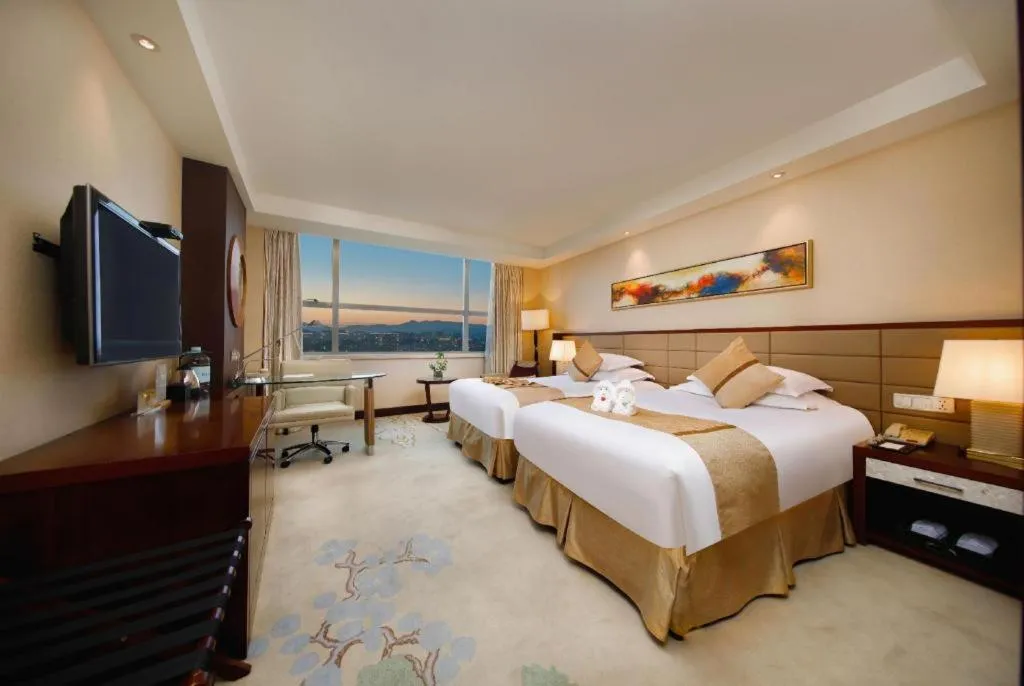 Bed in New Century Grand Hotel Lishui Huaqiao
