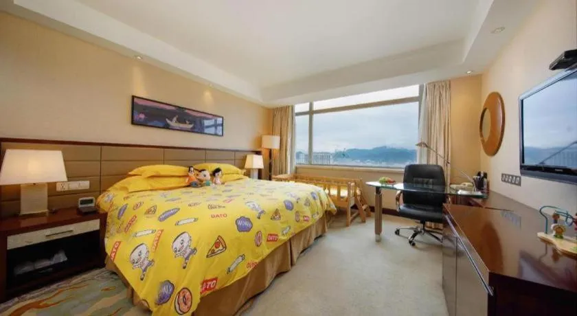 Bed in New Century Grand Hotel Lishui Huaqiao