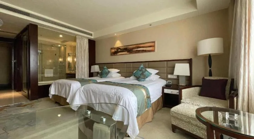 Bed in New Century Grand Hotel Lishui Huaqiao