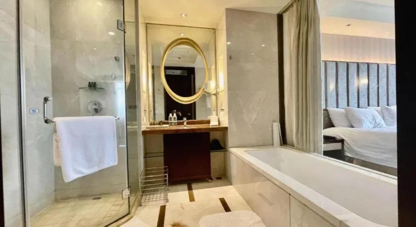 Bed in New Century Grand Hotel Lishui Huaqiao