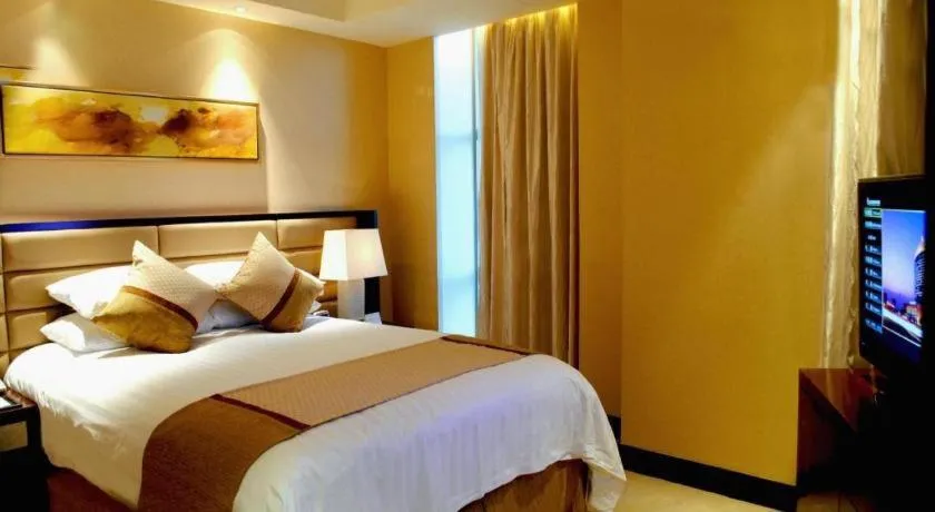 Bed in New Century Grand Hotel Lishui Huaqiao
