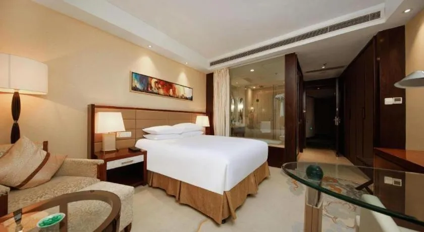 Bed in New Century Grand Hotel Lishui Huaqiao