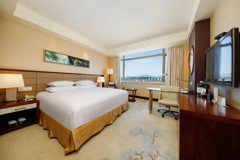 Bed in New Century Grand Hotel Lishui Huaqiao