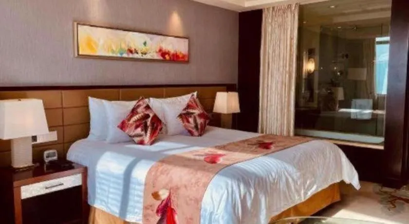 Bed in New Century Grand Hotel Lishui Huaqiao