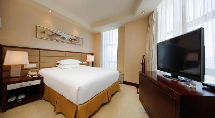 Bed in New Century Grand Hotel Lishui Huaqiao