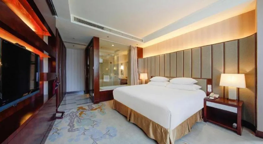 Bed in New Century Grand Hotel Lishui Huaqiao
