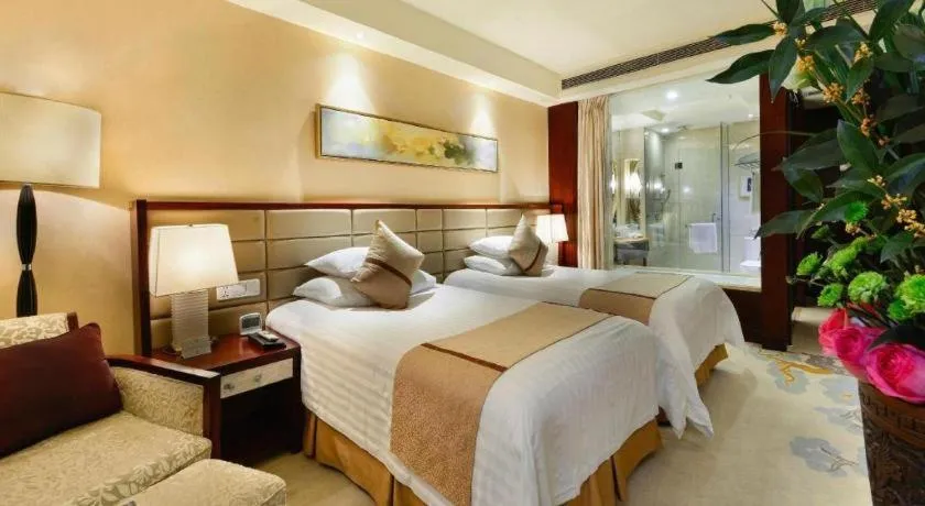 Bed in New Century Grand Hotel Lishui Huaqiao