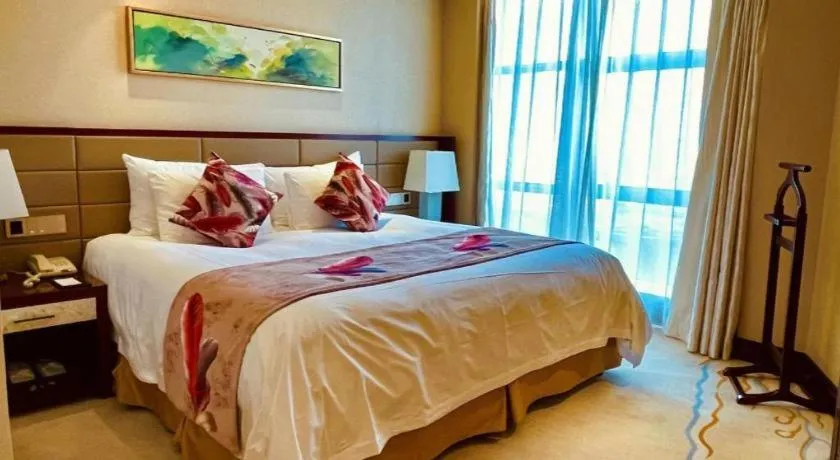 Bed in New Century Grand Hotel Lishui Huaqiao