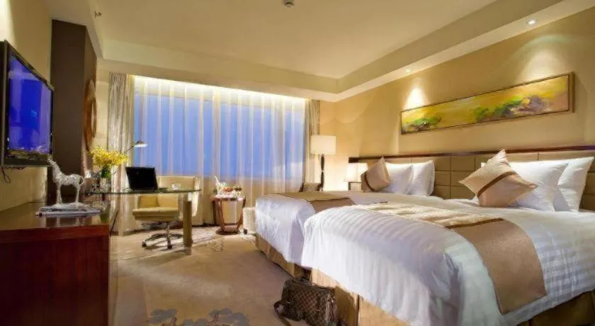 Bed in New Century Grand Hotel Lishui Huaqiao