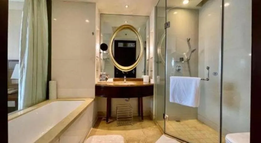 Bed in New Century Grand Hotel Lishui Huaqiao