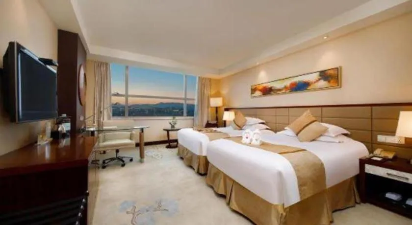 Bed in New Century Grand Hotel Lishui Huaqiao