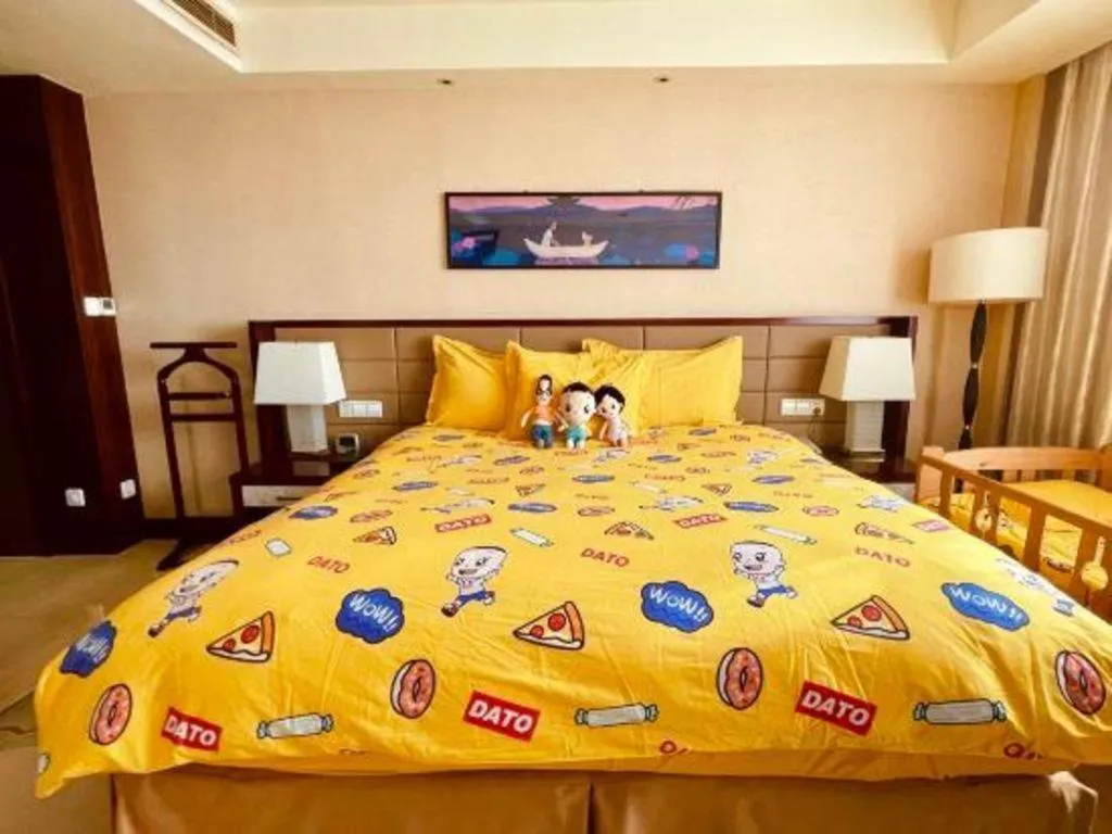 Bed in New Century Grand Hotel Lishui Huaqiao