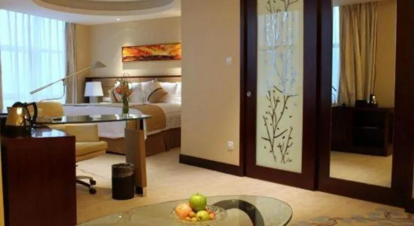 Bed in New Century Grand Hotel Lishui Huaqiao