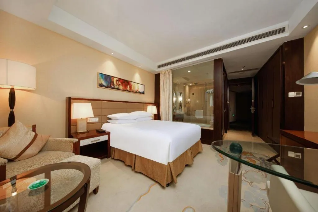 Bed in New Century Grand Hotel Lishui Huaqiao