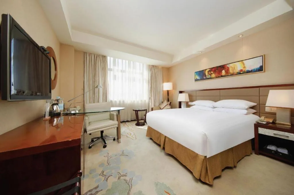 Bed in New Century Grand Hotel Lishui Huaqiao