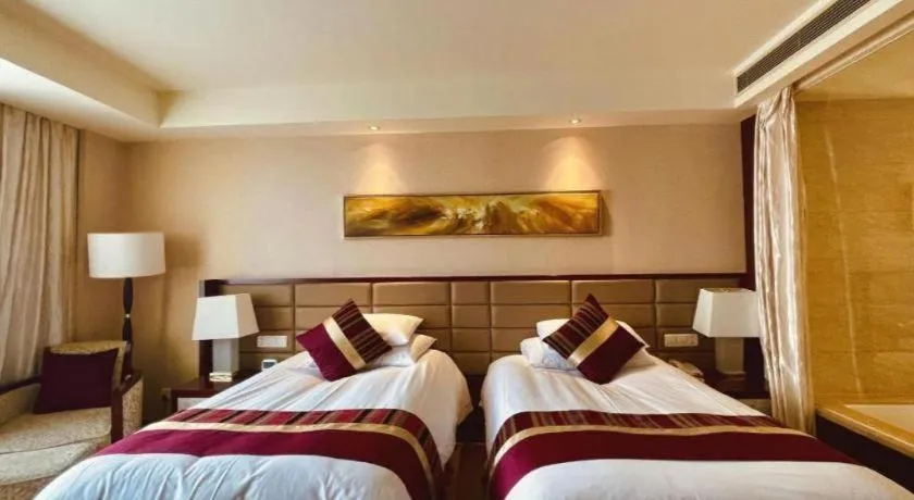Bed in New Century Grand Hotel Lishui Huaqiao
