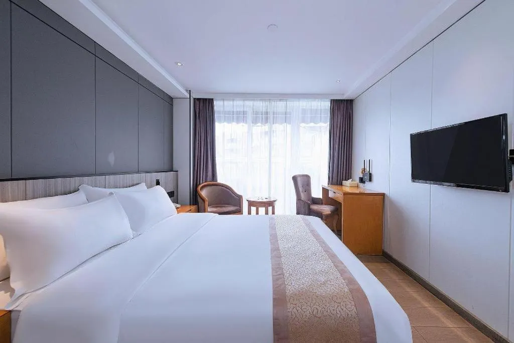 Bed in Zhongshan Louis Hotel