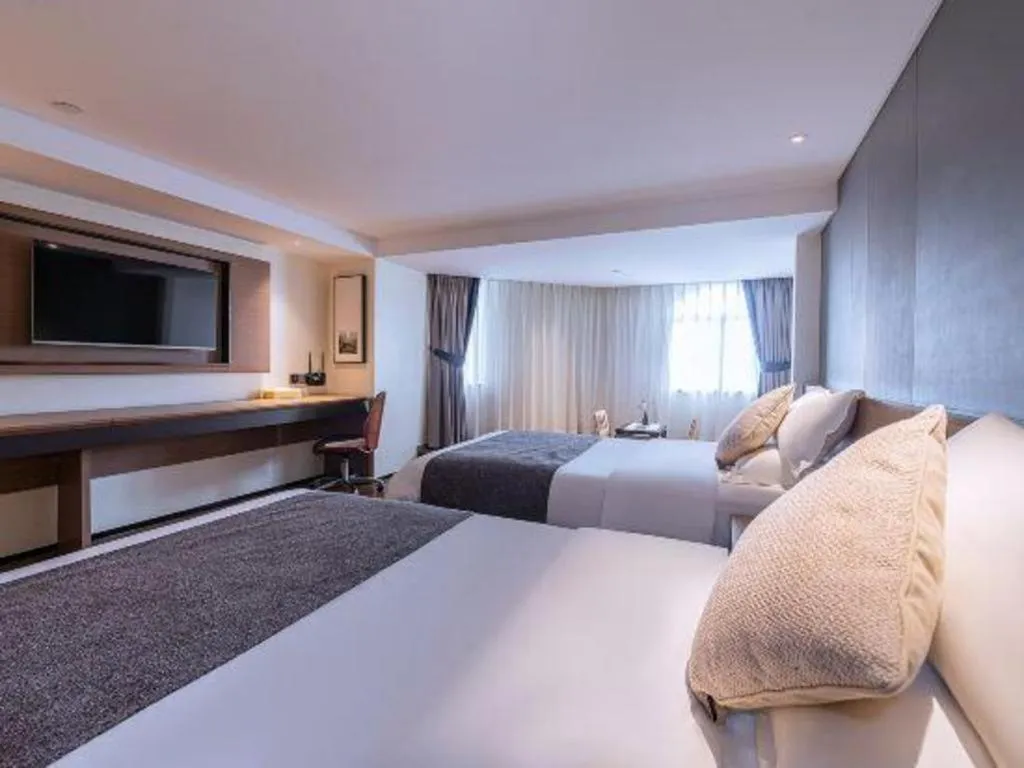 Bed in Zhongshan Louis Hotel