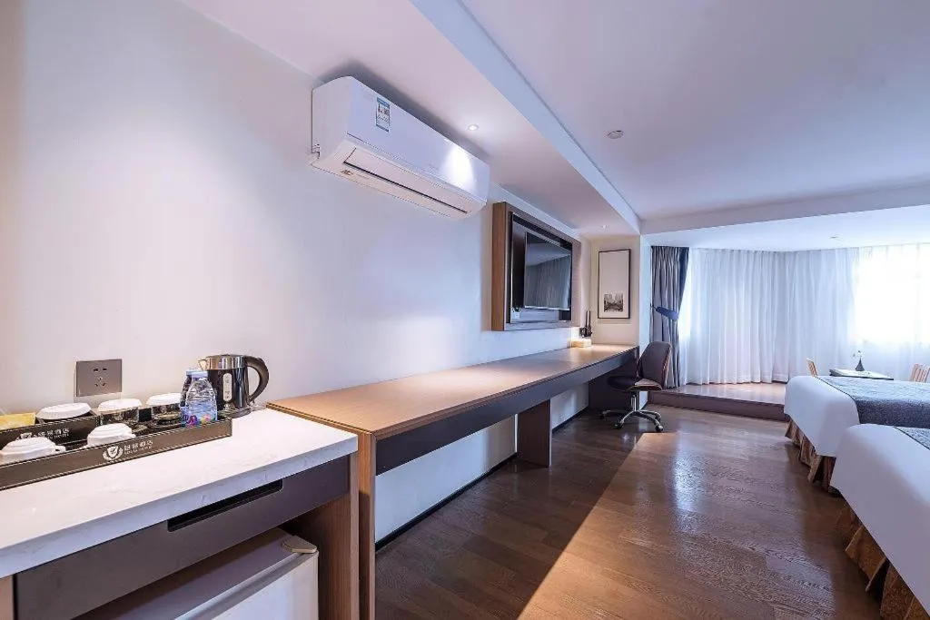 Bed in Zhongshan Louis Hotel