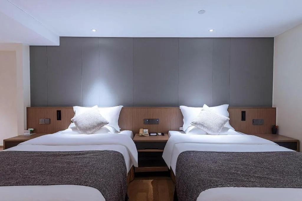 Bed in Zhongshan Louis Hotel