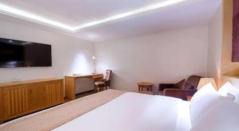 Bed in Zhongshan Louis Hotel