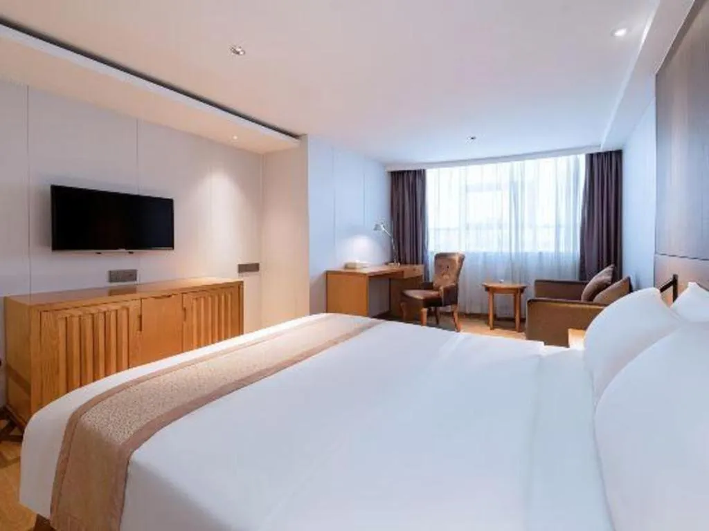 Bed in Zhongshan Louis Hotel