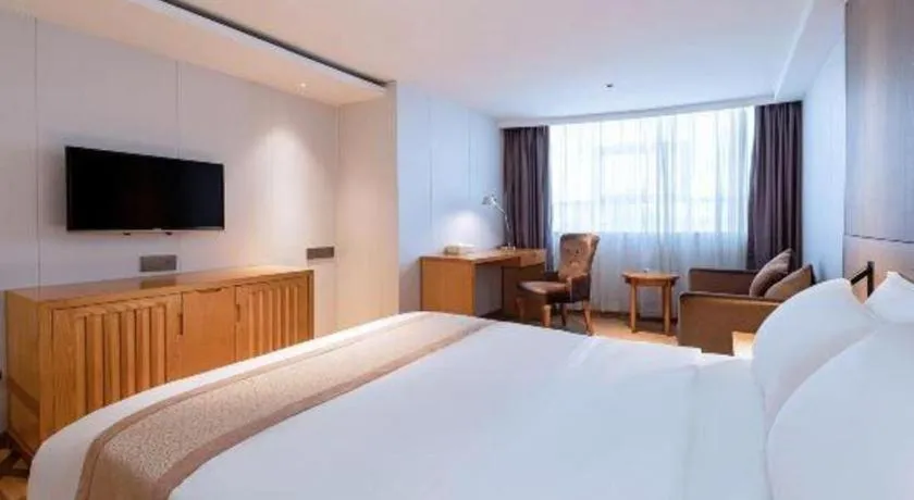 Bed in Zhongshan Louis Hotel