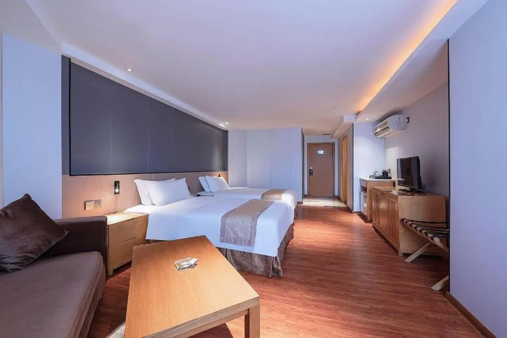 Bed in Zhongshan Louis Hotel