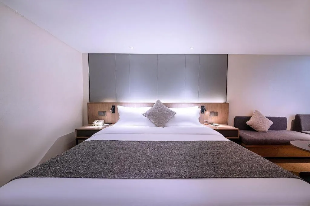 Bed in Zhongshan Louis Hotel