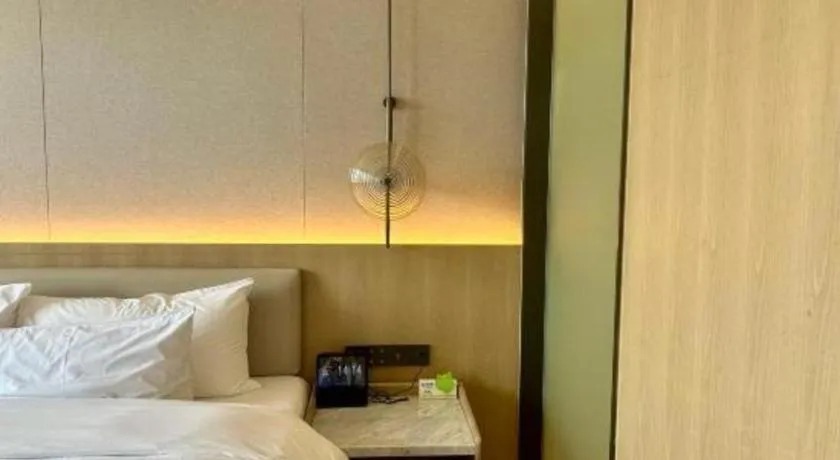 Bed in Zhangjiagang Jiangnan Garden Hotel