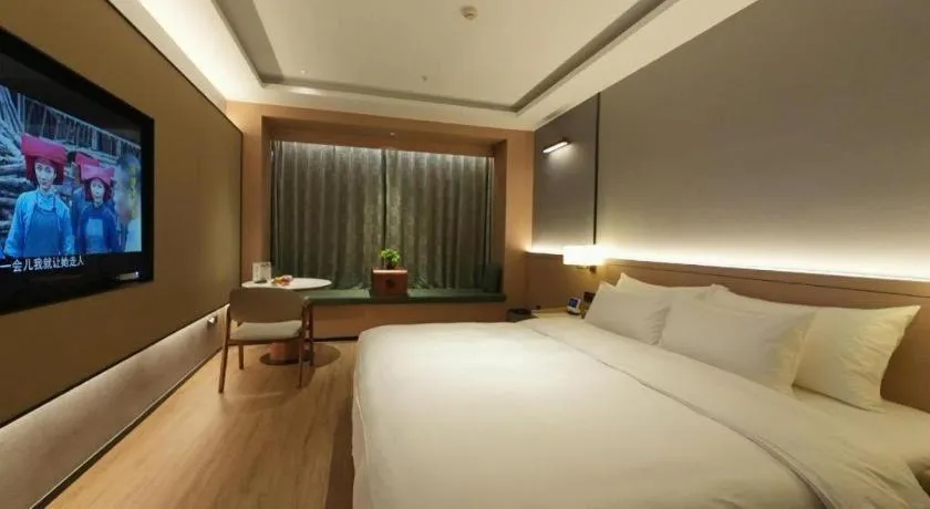 Bed in Zhangjiagang Jiangnan Garden Hotel