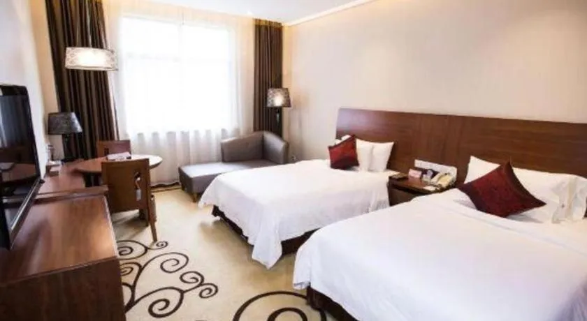 Bed in Zhangjiagang Jiangnan Garden Hotel