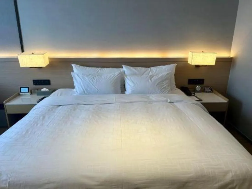 Bed in Zhangjiagang Jiangnan Garden Hotel